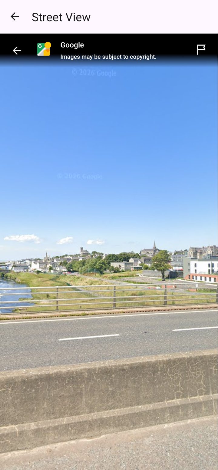 Street View of a town beside a river in Donegal inside Ireland Walk Nomad